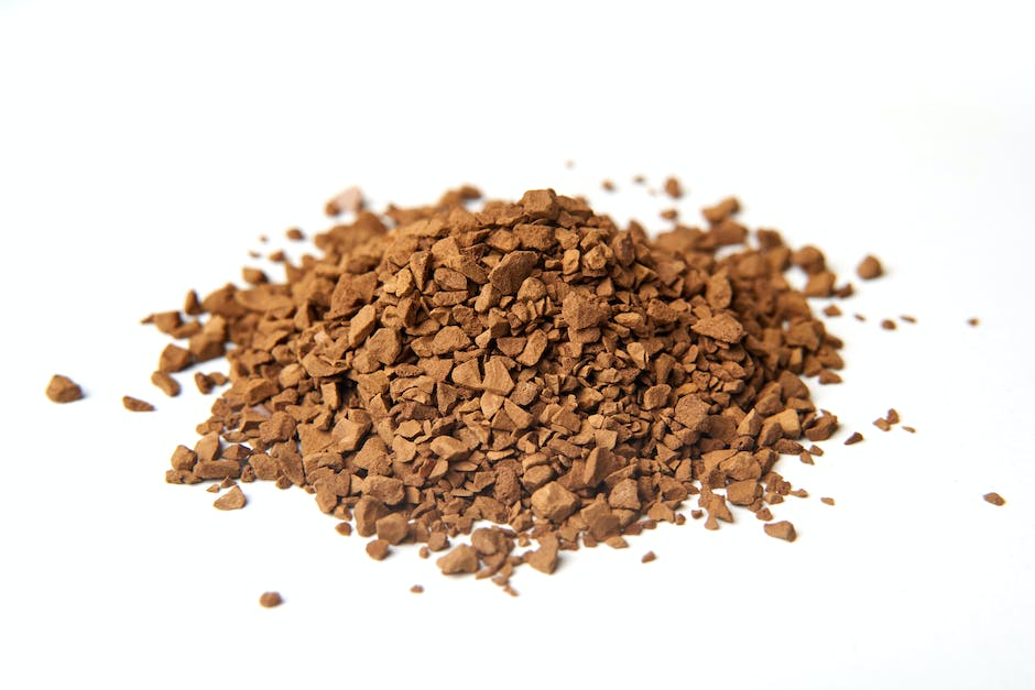 A closeup view of used coffee grounds for composting