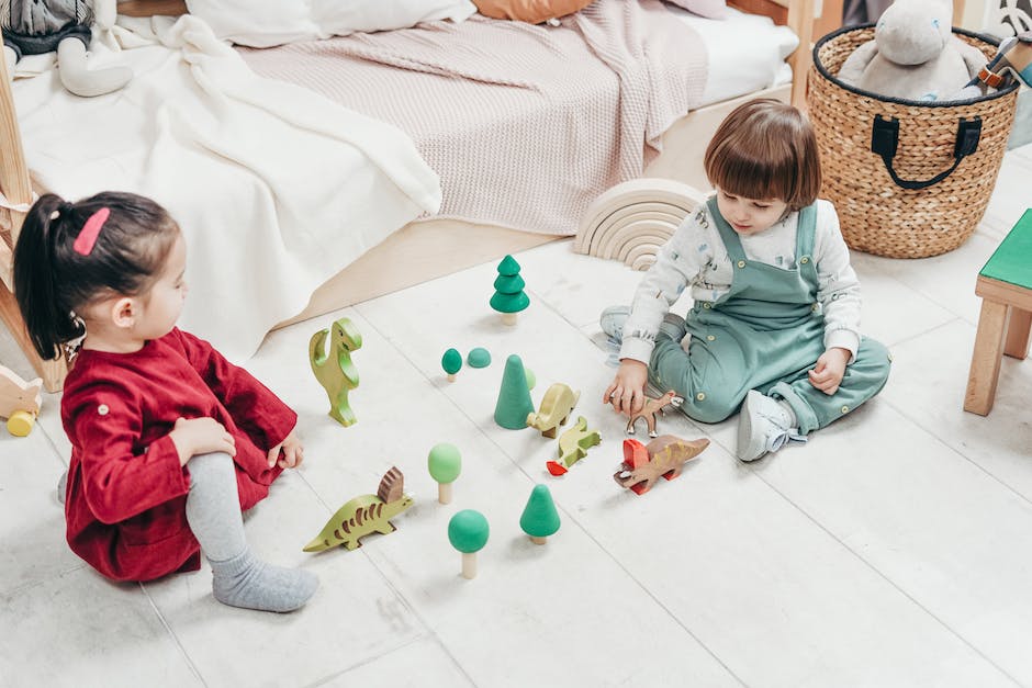 A happy cat playing with toys while surrounded by indoor greenery