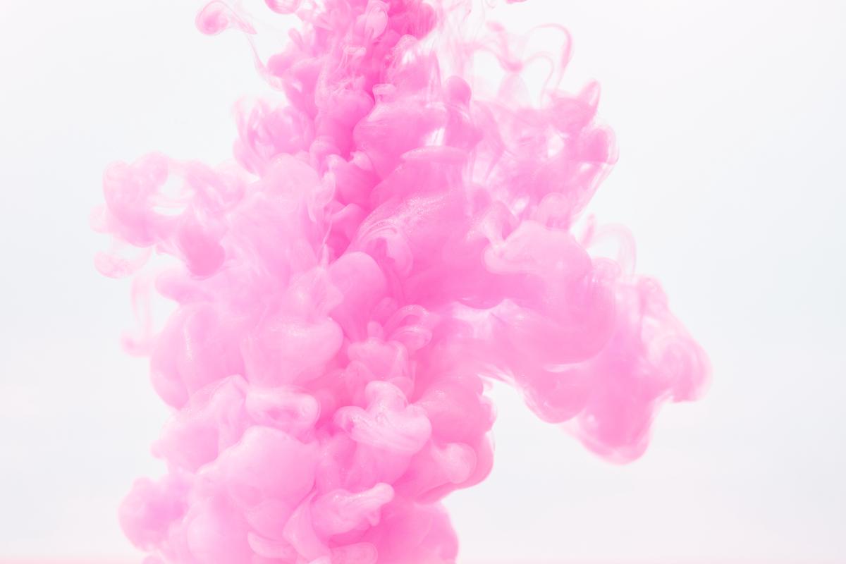 An image of a juicy pink-fleshed apple with a vibrant pink blush.