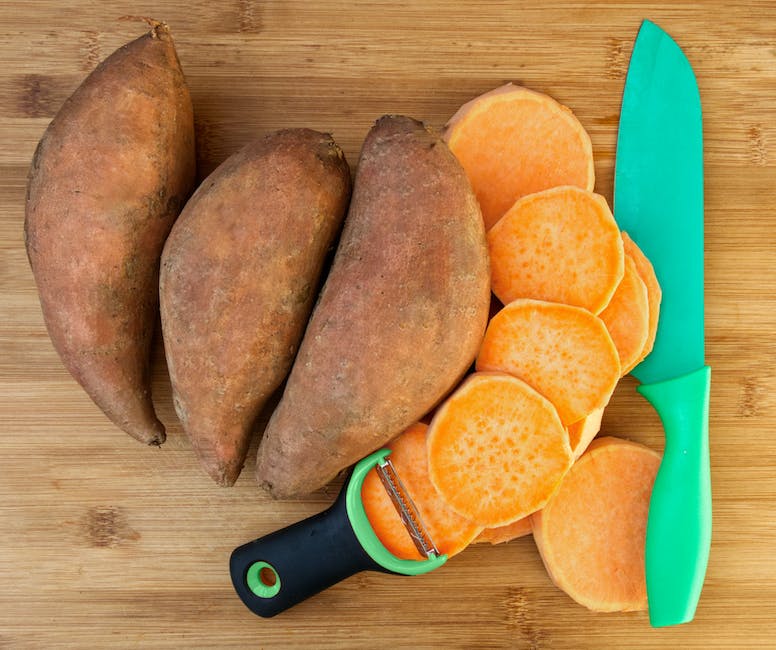 A bowl filled with freshly harvested sweet potatoes.